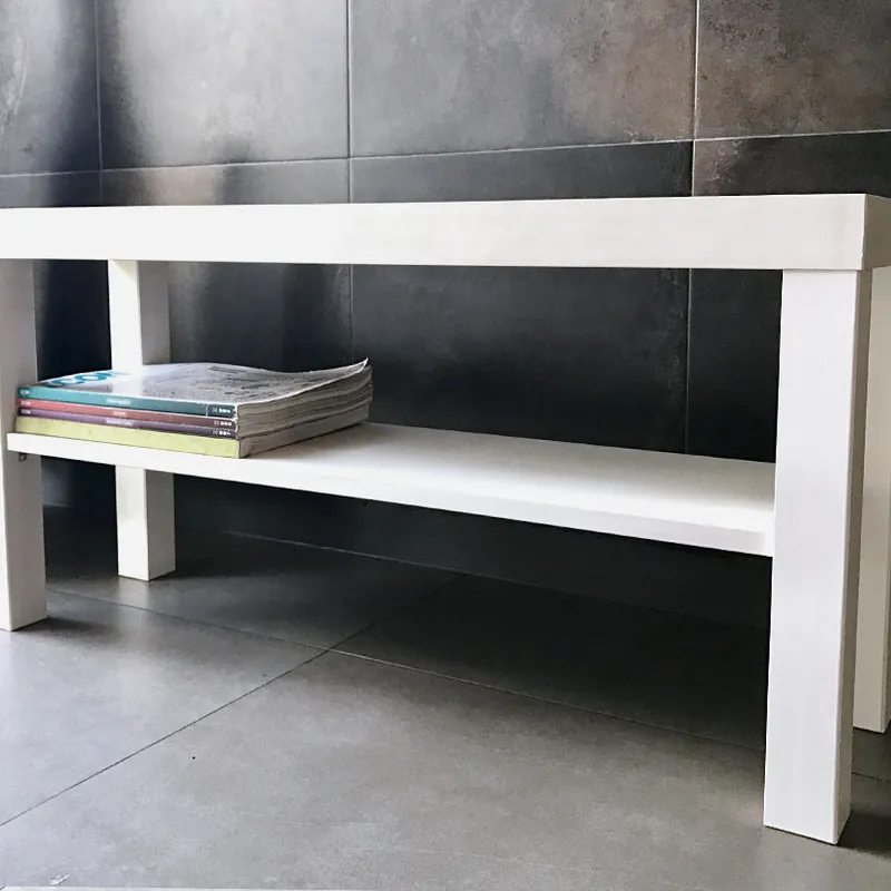 Simple Storage Bench, a white rectangular bench with a lower magazine shelf, on tiled flooring against a tiled wall